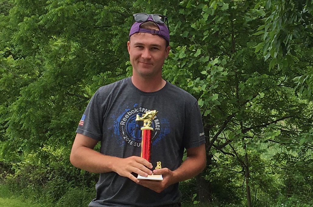 man holding trophy